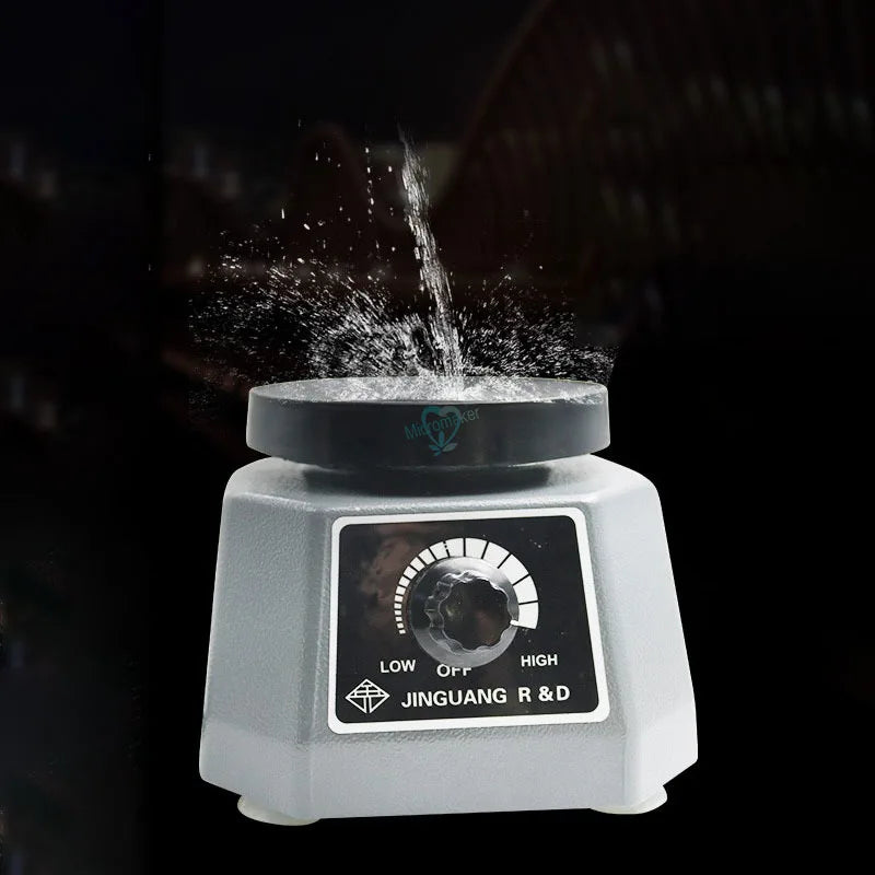 a white blender with a liquid coming out of it