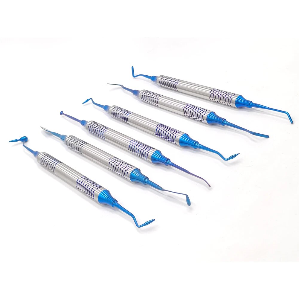 a group of blue and silver toothbrushes on a white surface