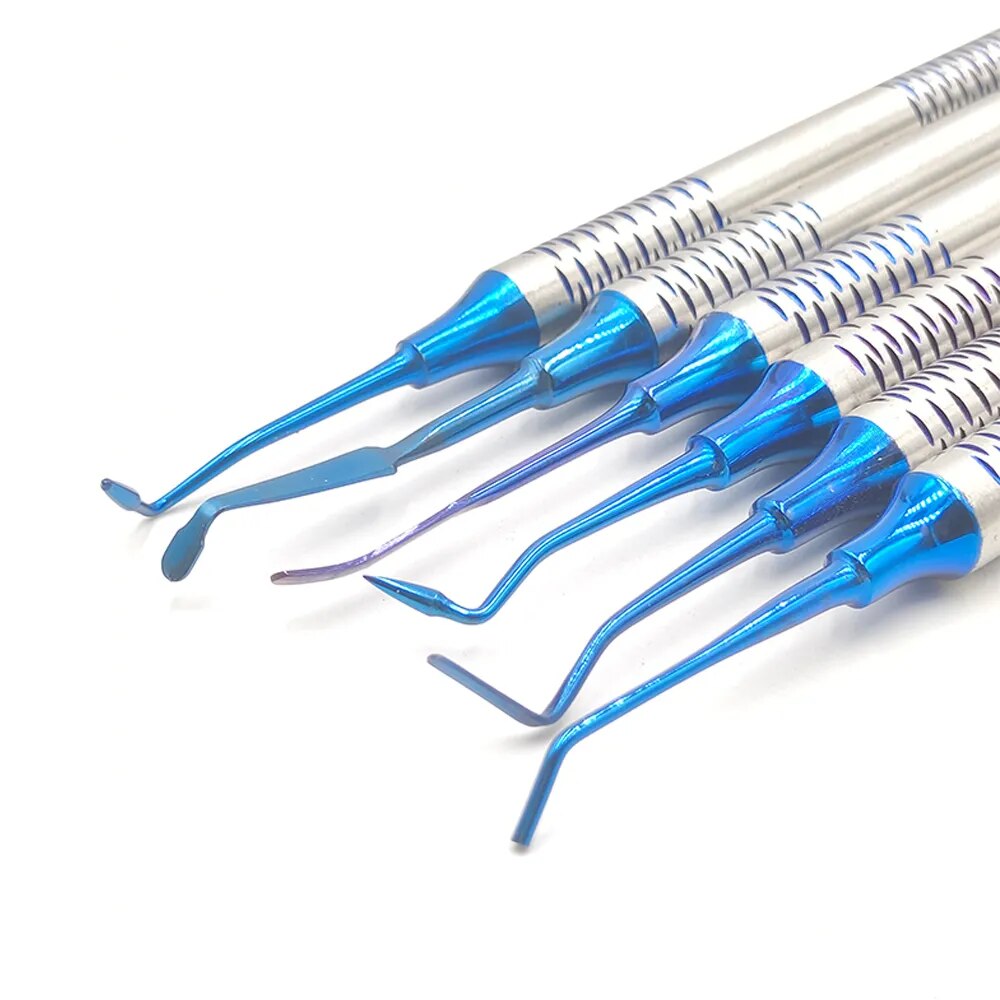 a group of blue and silver toothbrushes laying next to each other